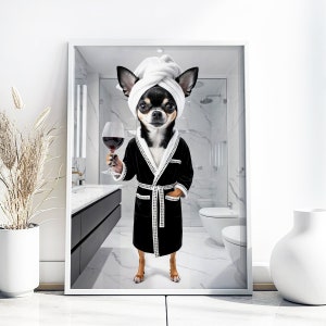 May include: A framed print featuring a Chihuahua wearing a white towel on its head and a black robe, holding a glass of red wine. The dog is in a bathroom setting with a white marble tile design.