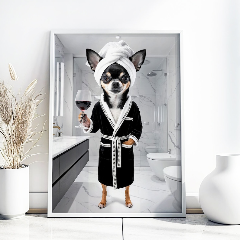 May include: A framed print featuring a Chihuahua wearing a white towel on its head and a black robe, holding a glass of red wine. The dog is in a bathroom setting with a white marble tile design.