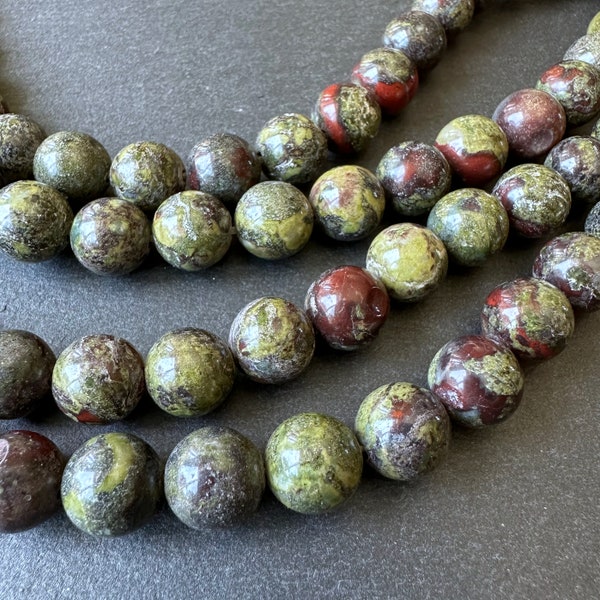 10mm dragon blood jasper beads (undyed) - round - smooth - natural - 15" strand - approx. 35 beads