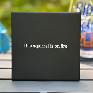This Squirrel is on Fire ceramic coaster