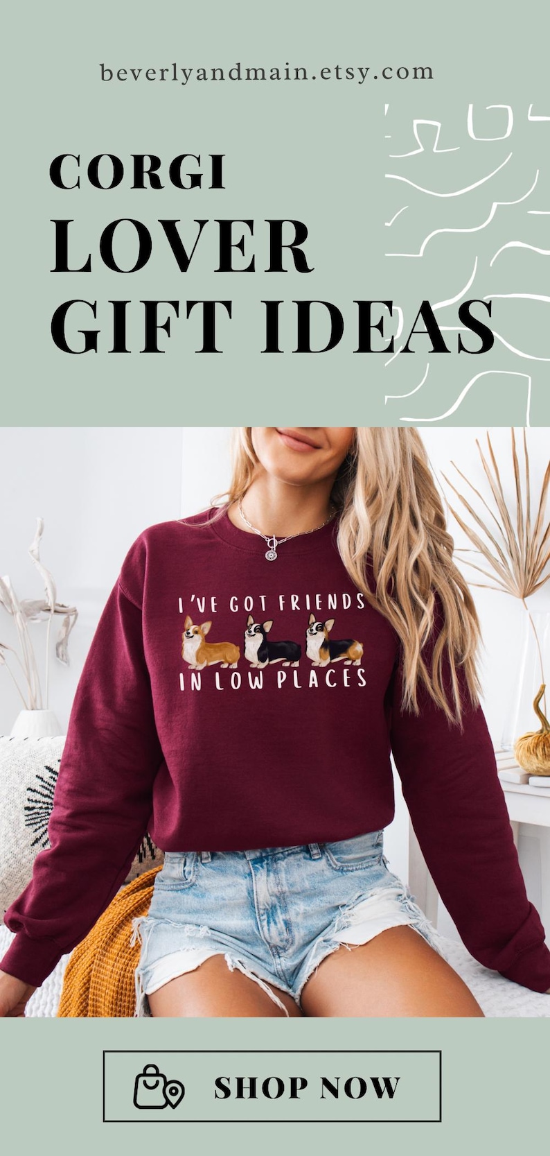 May include: A maroon sweatshirt with a graphic of three corgis and the text "I've got friends in low places".
