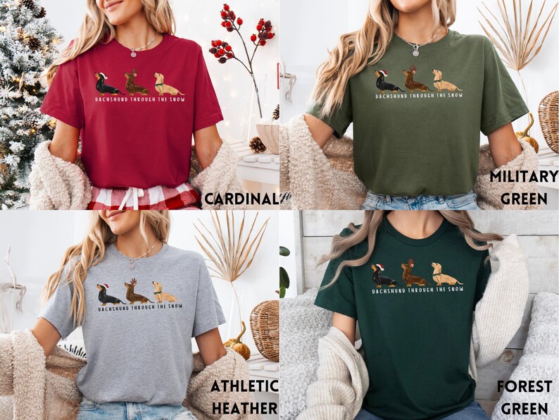May include: A t-shirt with a dachshund wearing a Santa hat and the text "Dachshund Through The Snow". The shirt is available in five colors: cardinal, military green, athletic heather, forest green, and black.