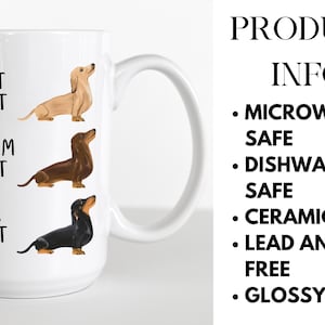 May include: White ceramic coffee mug with a black, brown, and light brown dachshund illustration. The mug has the text "Light Roast", "Medium Roast", and "Dark Roast" printed on it.