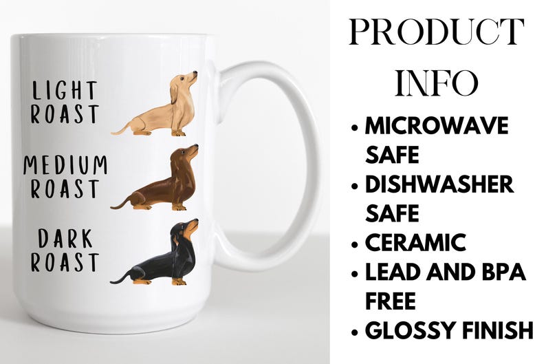 May include: White ceramic coffee mug with a black, brown, and light brown dachshund illustration. The mug has the text "Light Roast", "Medium Roast", and "Dark Roast" printed on it.