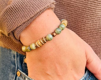 Eclectic Charm: Unique Bracelet with Varied Bead Shapes and Striking Tonal Variations