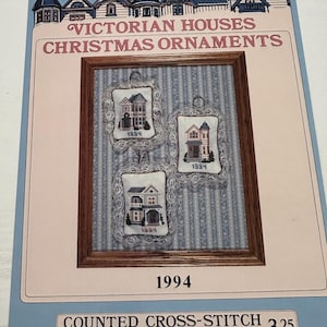 May include: A counted cross-stitch pattern for three Victorian house Christmas ornaments. The pattern is titled "Victorian Houses Christmas Ornaments" and is by Debbie Patrick. The pattern is dated 1994 and costs $3.25.