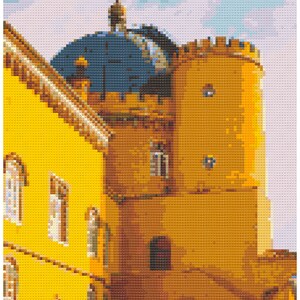 May include: A yellow building with a blue domed roof and a tower. The building has several windows and a doorway. The tower is tall and has a pointed roof.