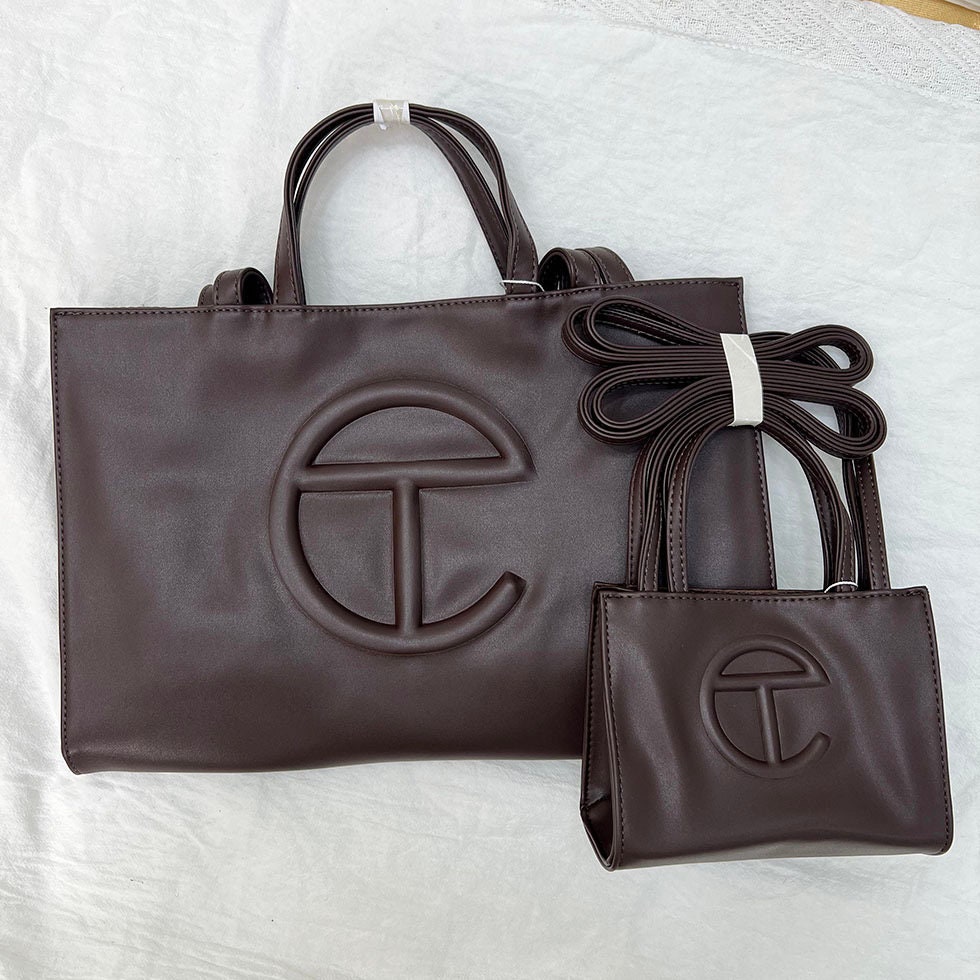 Guess' Logo Totes Are Drawing Comparisons to Telfar's Bags - PAPER Magazine