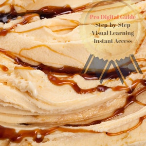 May include: Close-up of creamy, light brown ice cream with swirls of caramel sauce.