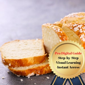 Puede incluir: Primer plano de una hogaza de pan cortada en tres rebanadas. El pan es blanco y tiene una corteza ligeramente dorada. El pan está espolvoreado con cristales de azúcar. La imagen incluye un sello dorado con el texto "Pro Digital Guide - Step-by-Step - Visual Learning - Instant Access".