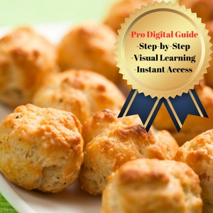 Könnte beinhalten: Nahaufnahme eines Tellers mit goldbraunen, runden, gebackenen Brötchen. Die Brötchen haben eine leicht raue Textur und sind in einer Gruppe angeordnet. Ein goldenes Band mit dem Text "Pro Digital Guide - Step-by-Step - Visual Learning - Instant Access" befindet sich im Hintergrund.