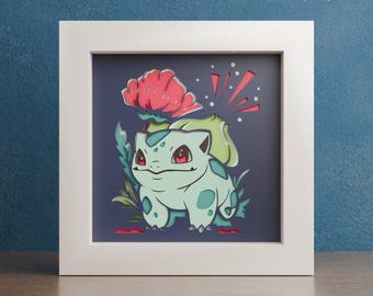 May include: A digital download of a layered paper cut design featuring a green and blue Bulbasaur Pokemon character with a red flower behind it. The design is set against a dark blue background.