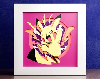 May include: A layered paper art piece featuring Pikachu, a yellow electric mouse character, set against a pink background. The artwork is framed in a white square frame, with the words "DIGITAL DOWNLOAD" at the top.