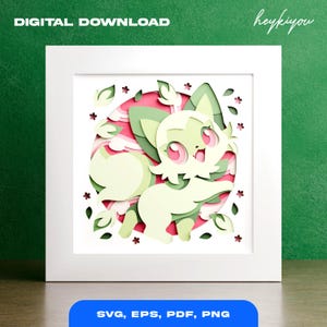 May include: A framed paper art piece featuring a layered design of a cartoon fox with green and cream-colored fur, pink eyes, and a smiling expression. The background includes pink and green elements. Text at the top reads "DIGITAL DOWNLOAD". The bottom text says "SVG, EPS, PDF, PNG".