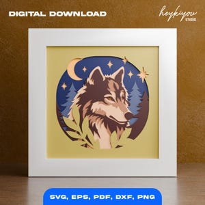 May include: A framed paper art piece featuring a wolf's head, a crescent moon, and stars against a dark blue background. The artwork is set within a white frame, with the words "DIGITAL DOWNLOAD" at the top and "SVG, EPS, PDF, DXF, PNG" at the bottom.