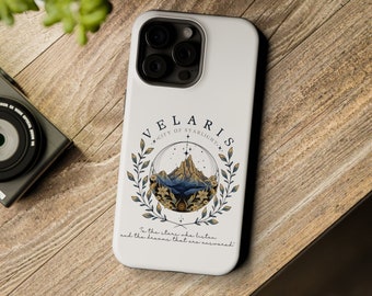 May include: White phone case with a mountain scene and the text "VELARIS CITY OF STARLIGHT" and "To the stars she listen and the dreams that are answered".