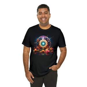 May include: A black t-shirt with a colorful graphic of a glowing sphere with a flower design inside. The sphere is surrounded by flowers.