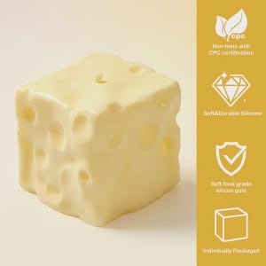 May include: A yellow, cube-shaped candle designed to look like a block of Swiss cheese. The candle features several holes and a glossy finish. The image includes text: "Non-toxic with CPC certification", "Soft&Durable Silicone", "Soft food grade silicon gule", and "Indivdually Packaged".