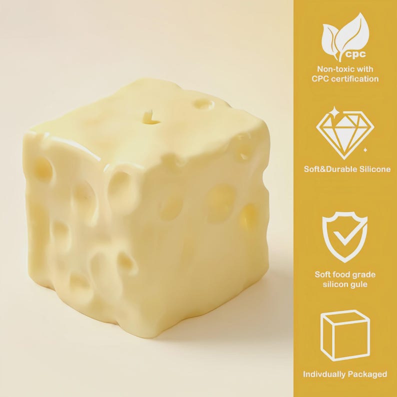 May include: A yellow, cube-shaped candle designed to look like a block of Swiss cheese. The candle features several holes and a glossy finish. The image includes text: "Non-toxic with CPC certification", "Soft&Durable Silicone", "Soft food grade silicon gule", and "Indivdually Packaged".