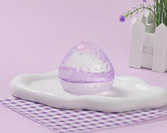 Taba de fresa morada que brilla en la oscuridad y es blandito