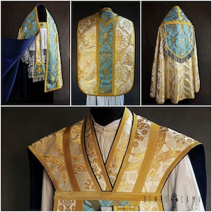 May include: A set of liturgical vestments in white, gold, and blue. The set includes a chasuble, a stole, and a cope. The fabric is a brocade with a floral pattern. The vestments are trimmed with gold braid and fringe.