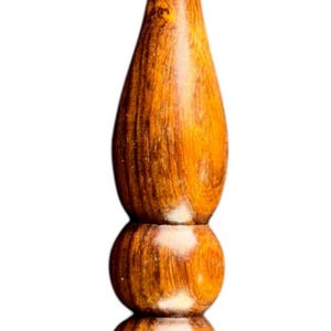 May include: A handcrafted wooden crochet hook with a polished finish. The hook features a curved head and a decorative handle with a bulbous design. The wood grain is visible, showcasing the natural color variations.