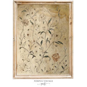 Puede incluir: Una impresión vintage enmarcada con un diseño botánico. La obra de arte presenta un fondo beige con elementos florales y de vid esbozados en marrón y verde. El marco es de madera clara y desgastada.