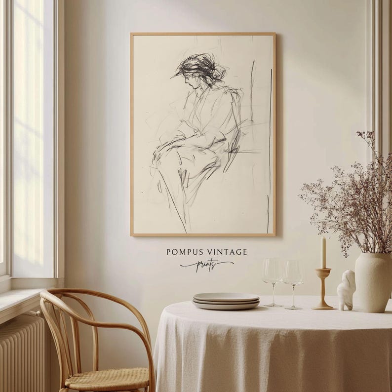 May include: A black and white line drawing of a person sitting in a chair. The drawing is on a cream-colored background and framed in a wooden frame. The image is titled "Pompous Vintage Prints".
