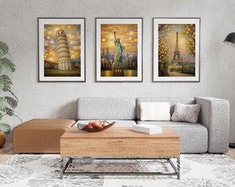 May include: Three framed prints of famous landmarks, each with a golden glow. The prints feature the Leaning Tower of Pisa, the Statue of Liberty, and the Eiffel Tower.