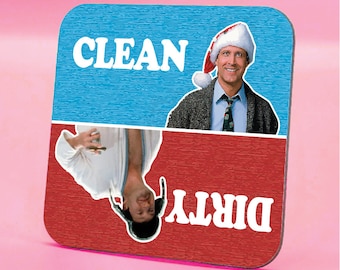 May include: A blue and red square magnet with the words "CLEAN" and "DIRTY" on it. The top half of the magnet features a man wearing a Santa hat, and the bottom half features the same man upside down.