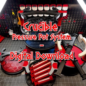 Może przedstawiać: Czarny i czerwony system Crucible Pressure Pot z napisem "Digital Download" w kolorze czerwonym i białym. System zawiera różne elementy, w tym okrągłą podstawę, podpory i górę o wzorze plastra miodu.