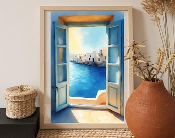 Puede incluir: Una impresión artística enmarcada representa una escena costera vista a través de una ventana abierta con contraventanas azules. La obra de arte muestra un mar azul vibrante, edificios blancos y un cielo brillante. El marco es de color madera clara.