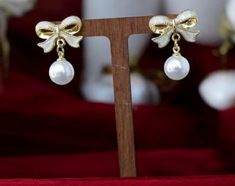 Gold Pearl Bow Earrings: Elegant Ribbon Dangle Studs