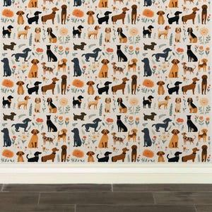 May include: A seamless pattern featuring a variety of dogs in different poses and colors, including brown, black, and white, on a cream background with floral accents.