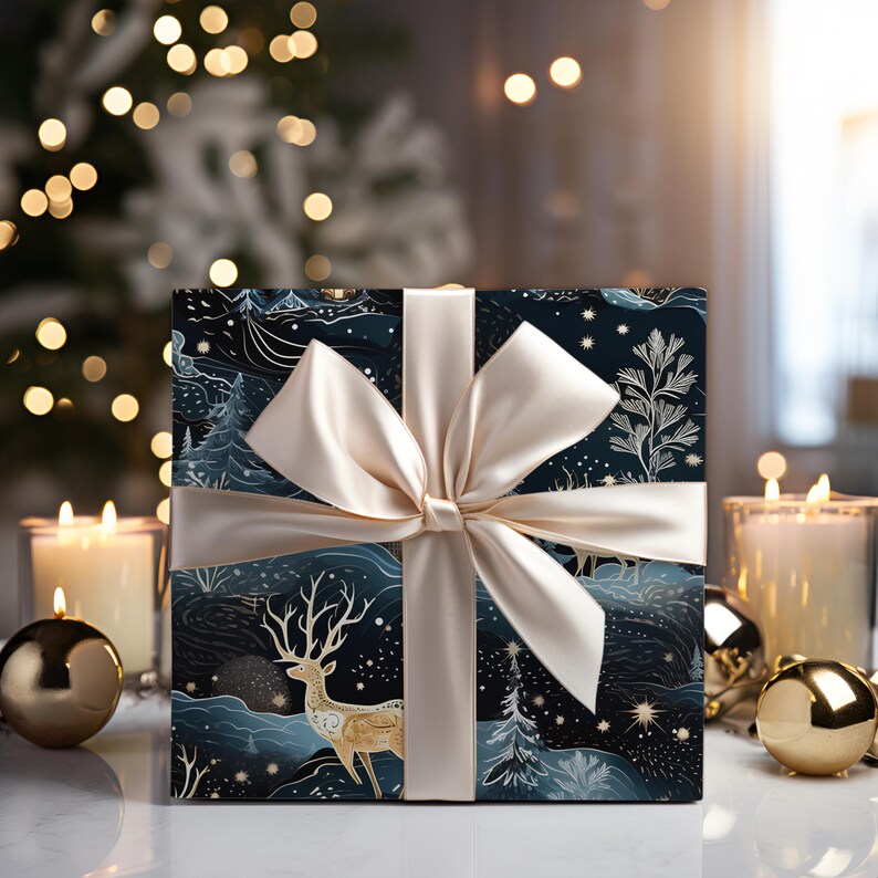 May include: A wrapped gift box with a cream-colored satin bow. The wrapping paper features a dark blue and white winter landscape design with a golden deer illustration. The scene includes trees, mountains, and stars, creating a festive holiday theme.