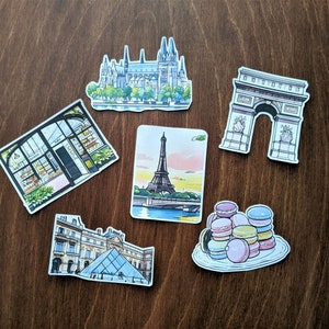 Lot d'autocollants : tour Eiffel, cathédrale Notre-Dame, macaron, pâtisserie, Arc de Triomphe, Louvre