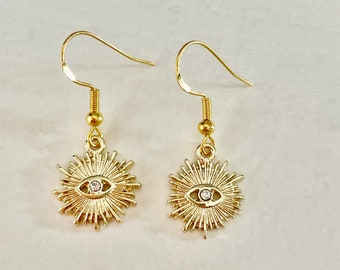 pretty sunburst evil eye earrings with crystal