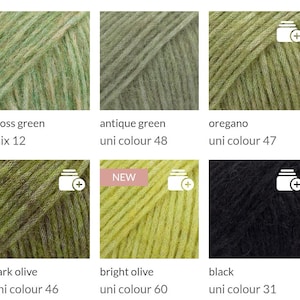 May include: Close-up of six skeins of yarn in various shades of green and black. Colors include moss green, antique green, oregano, dark olive, bright olive, and black. Each skein is labeled with its color name and a unique identifier.