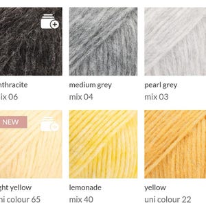 May include: A selection of yarn skeins in various colors, including anthracite, medium grey, pearl grey, light yellow, lemonade, and yellow. Each skein is labeled with its color name and mix or uni colour number. The light yellow skein has a "NEW" label.