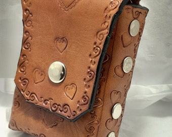 Veggie Tan Leather cigarette case. Simple Scroll work with heart stamp. Held together with stainless steel rivets