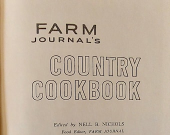 May include: Open book page with the title "FARM JOURNAL'S COUNTRY COOKBOOK" in bold, black letters. The book's cover features the publisher's name and the editor's name. The book is published by Doubleday & Company, Inc.