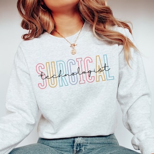 May include: A gray sweatshirt with the text "SURGICAL technologist" in rainbow colors.