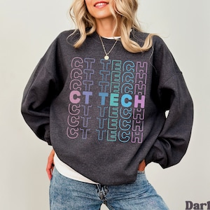May include: A dark heather grey sweatshirt with the text "CT TECH" repeated in a rainbow gradient pattern.