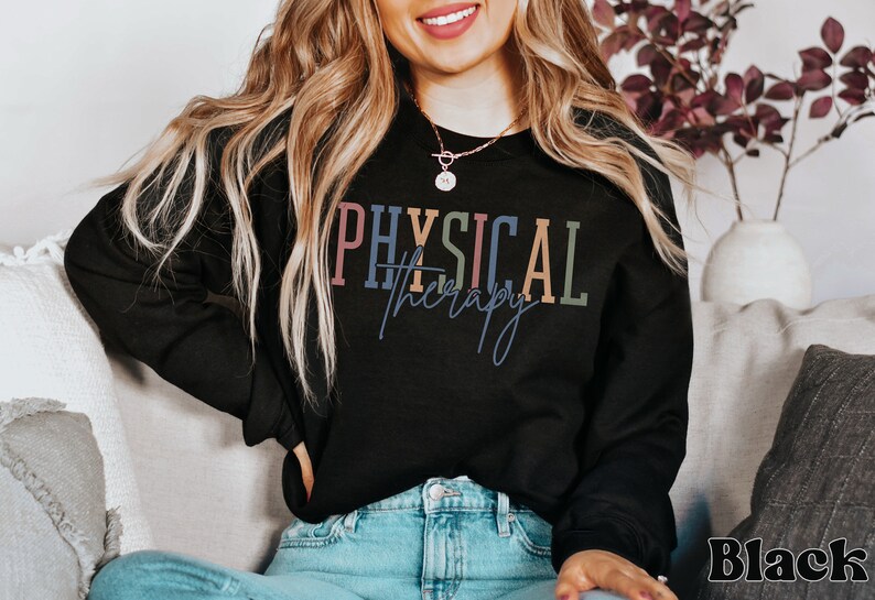 May include: A black sweatshirt with the text "PHYSICAL therapy" in colorful letters. The text is in a modern font style.