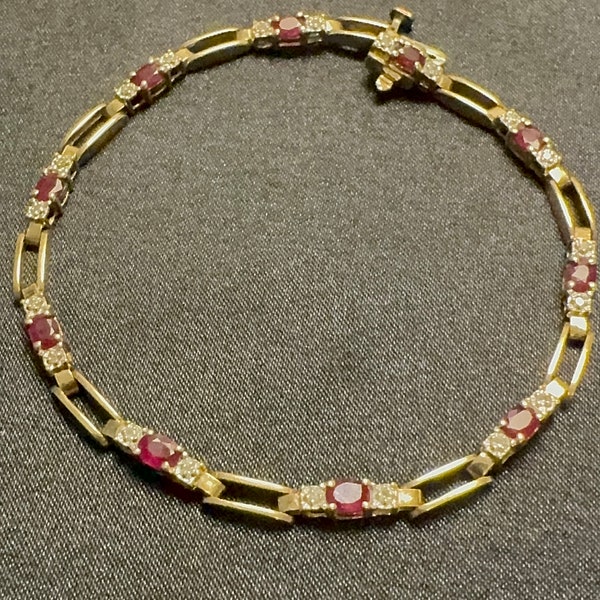 Ladies Genuine Ruby and Diamond Tennis Bracelet in 14 Kt Yellow Gold