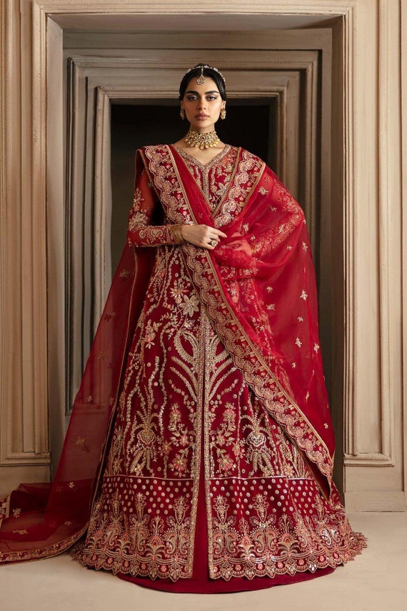 red and gold pakistani bridal dresses Gold & Red Bridal Dress Pakistani in Lehenga Gown Style is an epitome of tradition and royalty to have a magnificent appearance at the wedding. Hand-crafted embellishments and golden work on this