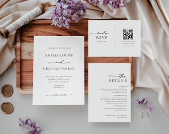 May include: Wedding invitation suite with white cardstock and black calligraphy. The main invitation card features the names Amelia Louise and Nikolas Parker, the wedding date, and the location. A smaller card includes the details of the wedding, including the reception, accommodation, and transportation. A third card has the RSVP information and a QR code.