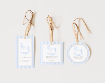 May include: Three blue and white striped thank you tags with a rocking horse illustration and the text "Thank You for celebrating with love". The tags are attached to brown twine.