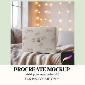 May include: A white laptop with a floral design on the lid is sitting on a white blanket. The laptop is open and the screen is blank. The laptop is in a cozy setting with string lights in the background. The text "PROCREATE MOCKUP" is at the bottom of the image, with the text "Add your own artwork!" and "FOR PROCREATE ONLY" below it.