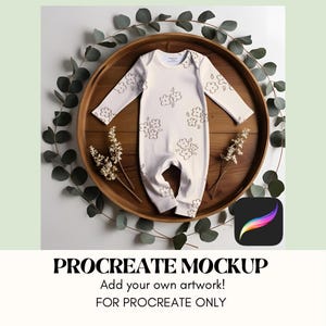 May include: A white baby onesie with a brown floral pattern on a wooden tray with greenery around it. The onesie is a Procreate mockup for adding your own artwork.